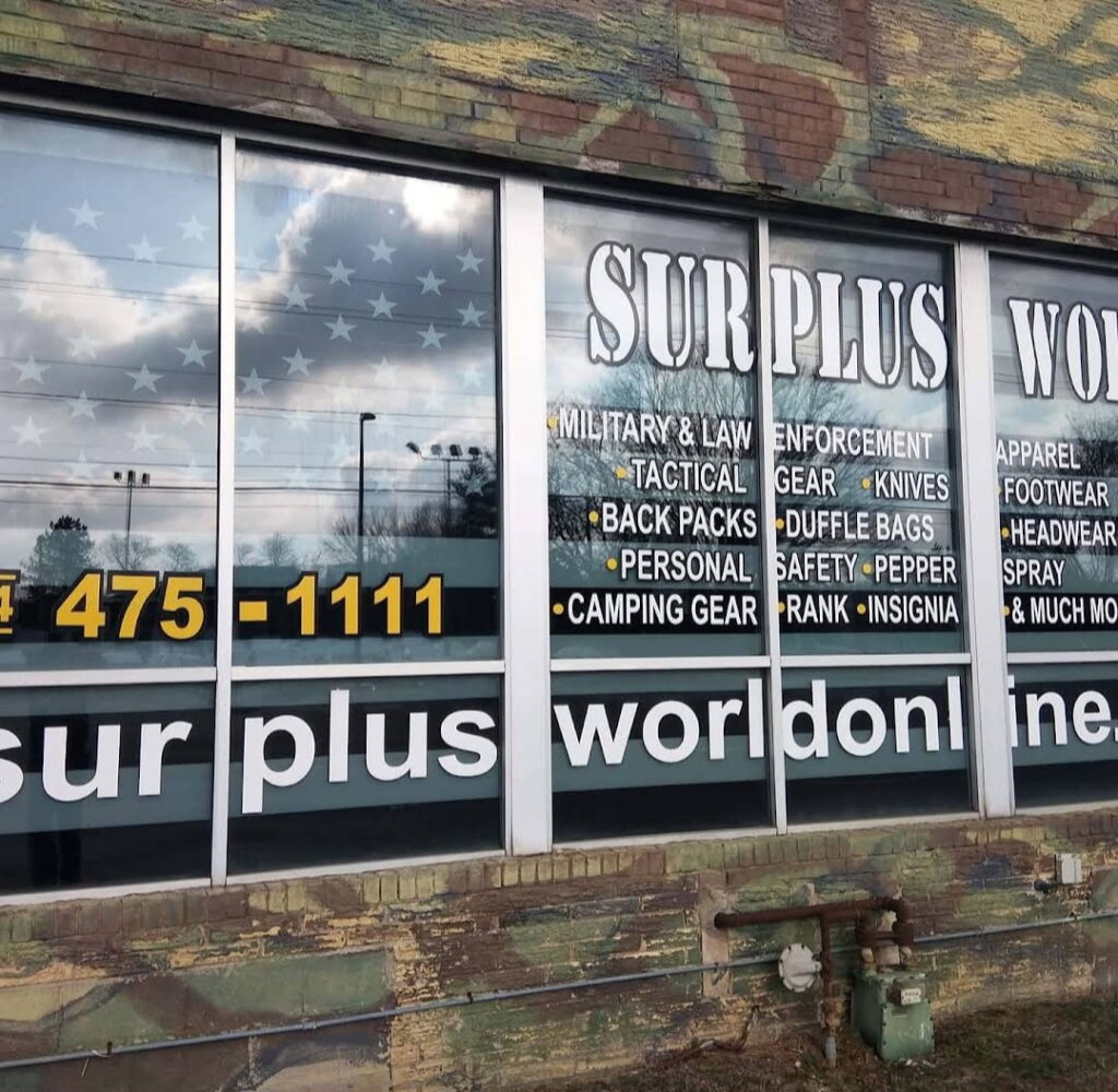 Window display of a surplus store, showcasing military and tactical gear